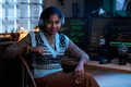 Portrait of Young South Asian Woman Wearing Headphones Working at Computer - PhotoDune Item for Sale