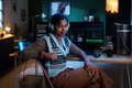 Portrait of Young South Asian Woman Listening to Music While Programming - PhotoDune Item for Sale