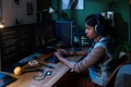 Young South Asian Woman Coding Software on Computer Monitors at Night - PhotoDune Item for Sale