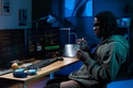 Young Black Man Working on Computer at Night in Office Setting - PhotoDune Item for Sale