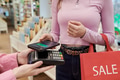 Young Woman Making Contactless Payment Using Smartphone in Store - PhotoDune Item for Sale