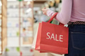 Young Woman Holding Shopping Bags during Retail Sale Event - PhotoDune Item for Sale