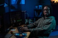 Portrait of Young Black Man Coding on Computer at Desk in Dark Office - PhotoDune Item for Sale