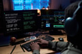 Young Black Man Coding Software on Computer Monitors at Night - PhotoDune Item for Sale