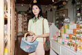 Young Asian Woman Shopping for Skincare Products in Store Aisle - PhotoDune Item for Sale