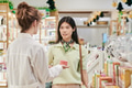 Young Asian Woman Consulting Female Pharmacist While Shopping - PhotoDune Item for Sale