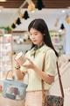 Asian Teenager Girl Shopping and Examining Cosmetic Product in Store - PhotoDune Item for Sale