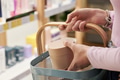 Young Woman Shopping for Cosmetics in Store Holding Product Basket - PhotoDune Item for Sale