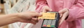 Young Woman Processing Payment with Credit Card at Checkout - PhotoDune Item for Sale