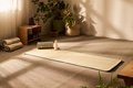Empty Yoga Studio Showing Sunlight Illuminating Mat with Massage Roller and Bottle - PhotoDune Item for Sale