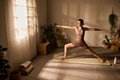 Young Adult Caucasian Woman Practicing Yoga Posing in Sunlit Home Studio - PhotoDune Item for Sale