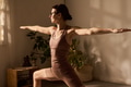 Caucasian Young Adult Woman Practicing Yoga Posing in Sunlit Room Indoors - PhotoDune Item for Sale