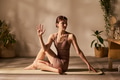 Young Adult Caucasian Woman Practicing Seated Yoga Twist on Exercise Mat - PhotoDune Item for Sale
