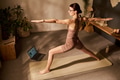 Caucasian Young Adult Woman Balancing in Warrior Pose during Virtual Yoga Session - PhotoDune Item for Sale
