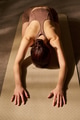 Caucasian Young Adult Woman Stretching Arms Forward Practicing Restorative Yoga - PhotoDune Item for Sale