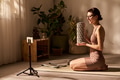 Young Caucasian Woman Recording Fitness Tutorial Using Foam Roller Indoors - PhotoDune Item for Sale