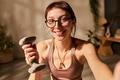 Portrait of Young Adult Caucasian Woman Smiling While Holding Dumbbell Indoors - PhotoDune Item for Sale