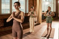 Young Caucasian Women Practicing Yoga Together in Sunlit Studio - PhotoDune Item for Sale