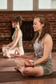 Young Caucasian Women Practicing Meditation during Yoga Session Indoors - PhotoDune Item for Sale
