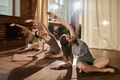 Group of Young Adult Women Practicing Yoga Stretching in Studio - PhotoDune Item for Sale