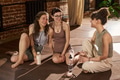 Three Young Adult Caucasian Women Smiling and Relaxing after Yoga Session - PhotoDune Item for Sale
