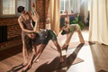 Young Caucasian Woman Instructing Two Women Practicing Yoga Indoors - PhotoDune Item for Sale
