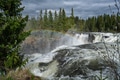 Ristafallet Waterfall in Sweden with a rainbow in the sky. - PhotoDune Item for Sale