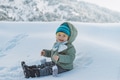 Cute Baby Boy Playing in Snow Wearing Warm Winter Clothes - PhotoDune Item for Sale
