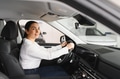 Cheerful female client of car dealership - PhotoDune Item for Sale