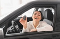 Young woman choosing a car at car showroom - PhotoDune Item for Sale