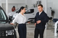 Man customer male buyer client consult with salesman signs documents choose auto - PhotoDune Item for Sale