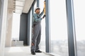 Construction worker using spirit level on window frame - PhotoDune Item for Sale