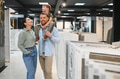 Family choosing ceramic tiles in hardware store - PhotoDune Item for Sale
