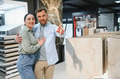 Couple choosing ceramic tiles in a hardware store - PhotoDune Item for Sale