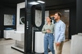 Couple choosing bathroom fixtures in plumbing store - PhotoDune Item for Sale