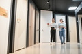 Salesman showing door models to woman in hardware store - PhotoDune Item for Sale