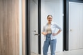 Smiling saleswoman posing in a ceramic tile and plumbing store - PhotoDune Item for Sale