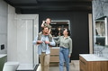 Family choosing bathroom fixtures in a showroom - PhotoDune Item for Sale