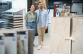 Couple choosing ceramic tiles in hardware store - PhotoDune Item for Sale