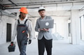 Architect showing laptop to builder during construction - PhotoDune Item for Sale