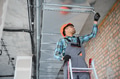 Hvac technician installing ventilation system on construction site - PhotoDune Item for Sale