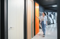 Customer choosing interior door in hardware store, woman selecting door in showroom - PhotoDune Item for Sale