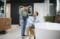 Couple choosing modern bathtub in bathroom furniture store - PhotoDune Item for Sale