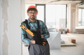 Arab engineer holding spirit level on construction site - PhotoDune Item for Sale