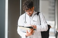 Young doctor studying medical books at university - PhotoDune Item for Sale
