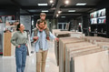 Family exploring ceramic tile and plumbing store together - PhotoDune Item for Sale