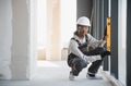 Construction worker checking window level with spirit level - PhotoDune Item for Sale