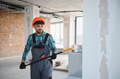 Arab engineer painting walls with roller in construction site - PhotoDune Item for Sale