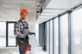 Construction worker installing ventilation system in modern building - PhotoDune Item for Sale