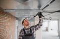 Construction worker installing ventilation system in building - PhotoDune Item for Sale